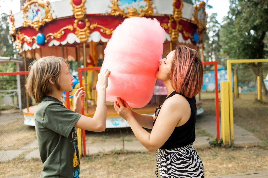 Mother and son playing with cotton candy at amusem 2025 03 13 00 03 45 utc
